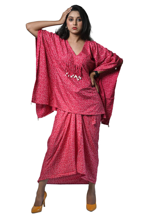 Model showcasing a stunning pink Bandhani Dhoti dress with intricate patterns, perfect for ethnic elegance.