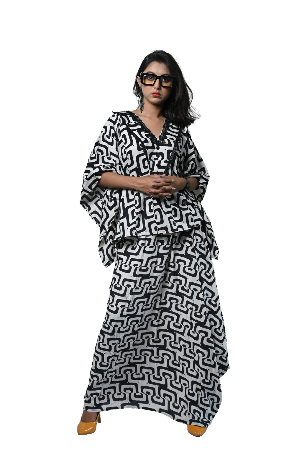 Black and white bold print dhoti set featuring a stylish kaftan kurta, embodying sophistication and contemporary flair.