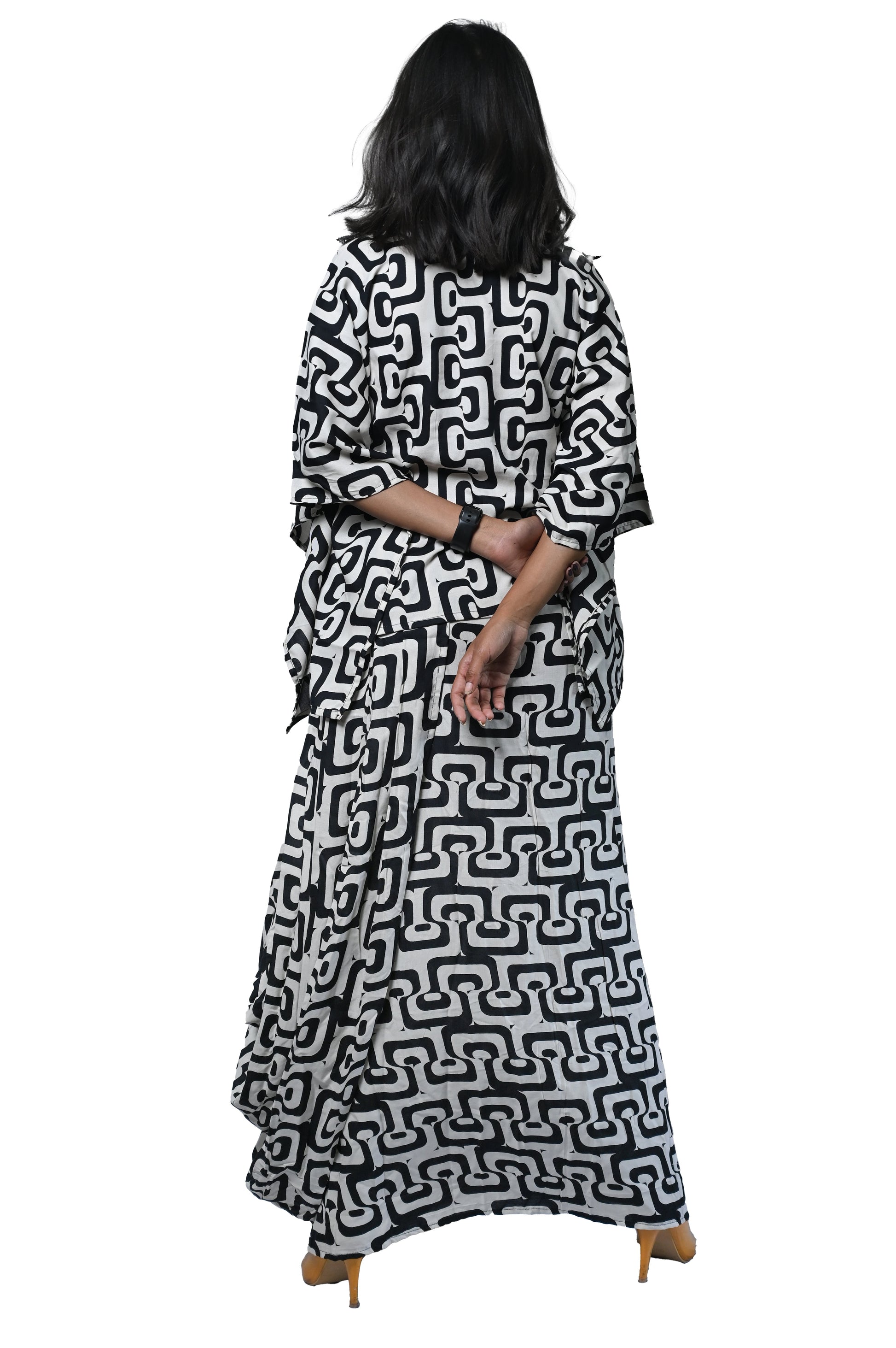 Black and white bold print dhoti set with a stylish kaftan kurta, showcasing intricate patterns and contemporary design.