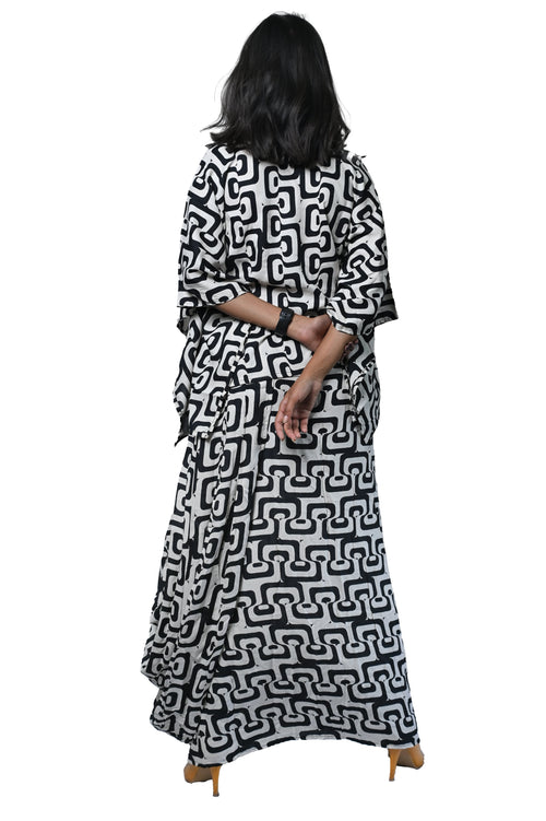 Black and white bold print dhoti set with a stylish kaftan kurta, showcasing intricate patterns and contemporary design.